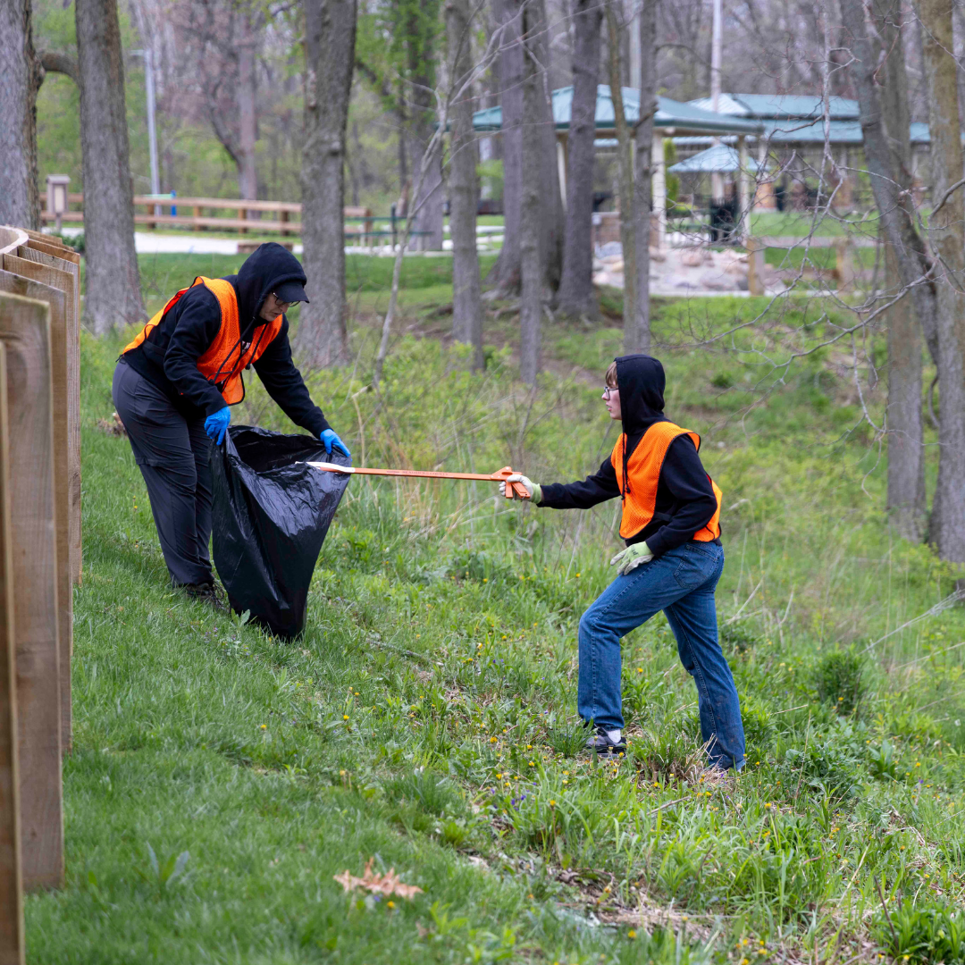People collecting trash in Arbuckle Acres Park